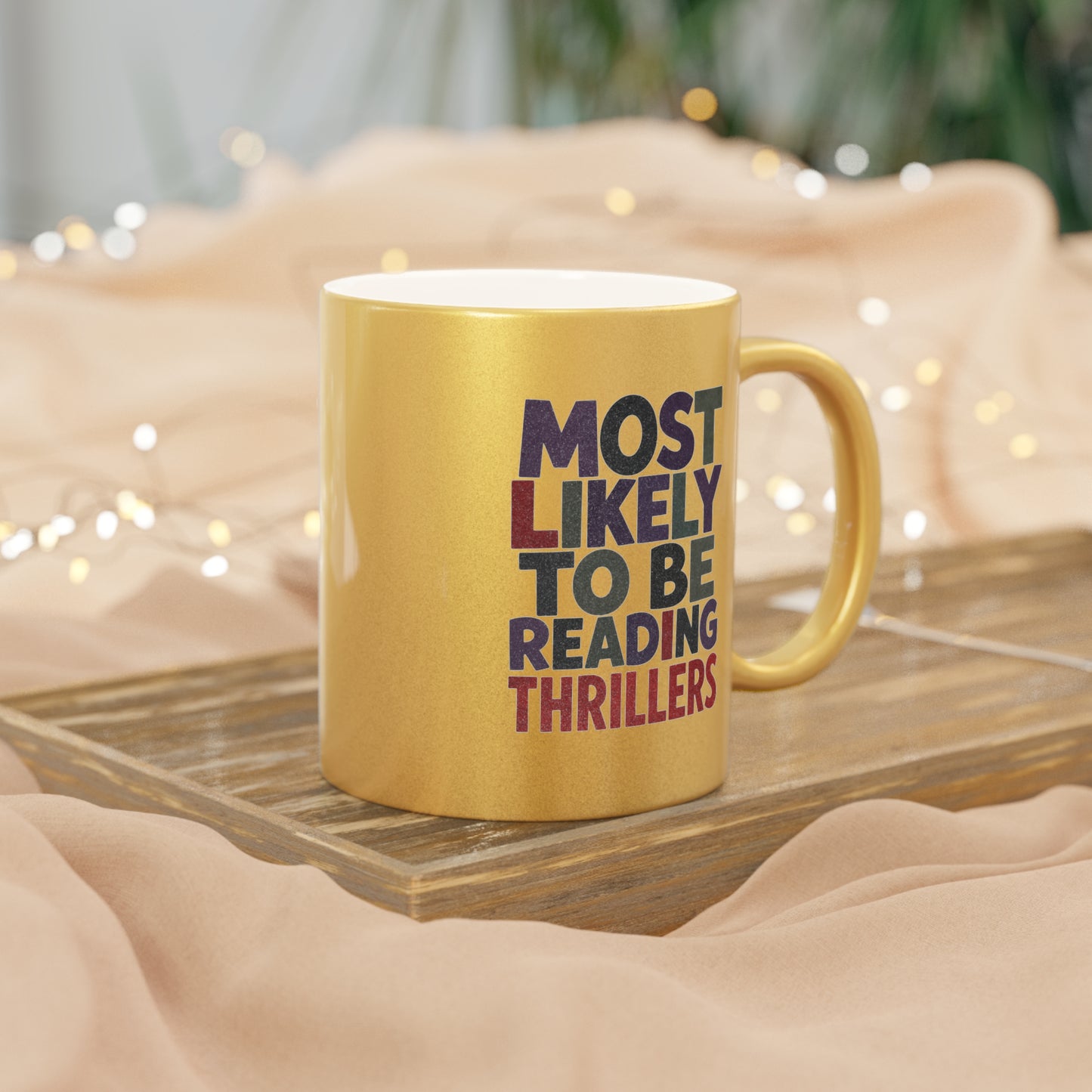 Metallic Mug — “Most Likely to Be Reading Thrillers” Gold Coffee Cup for Thriller Lovers